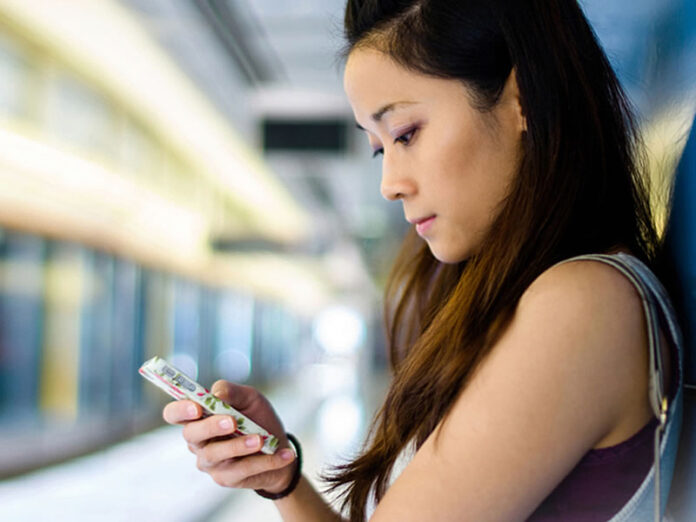 Filipina Girl Looking at Phone